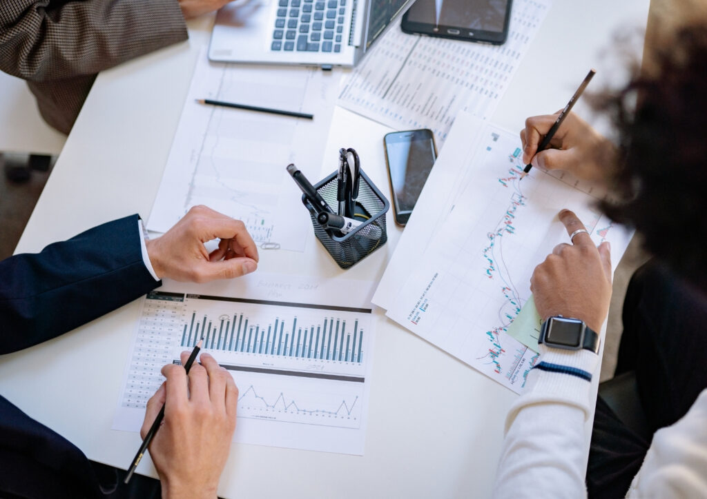 Financial planning documents and charts on a desk